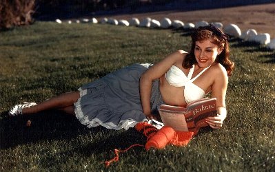 Paulette Goddard reading Balzac, with her knitting